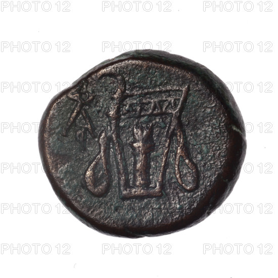 bronze coin, Pantikapaion; obv.: head of young Dionysus in an ivy wreath facing right; rv.: bow and arrows in gorytos with straps, monogram on the left; iconography: bow in quiver, head of Dionysus, quivers, gorytos, bows, weapons, armament; monograms; Dionysus (mythology); Black Sea, Cimmerian Bosporus, Pantikapaion; end of 2nd–ca. mid. 1st century BC (time of Mithridates VI Eupator, 120–63 BC); coin; weight 15.76 g; dimensions: 22.7 × 25 mm.