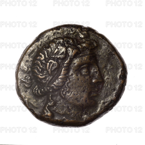 bronze coin, Pantikapaion; obv.: head of young Dionysus in an ivy wreath facing right; reverse: bow and arrows in a gorytos with straps, monogram on the left; iconography: bow in a quiver, head of Dionysus, gorytos, quivers, bows, weapons, armament; Dionysus (mythology); monograms; Black Sea; end of 2nd–ca. mid. 1st century BC (time of Mithridates VI Eupator, 120–63 BC); Cimmerian Bosporus; coin; weight 15.18 g; dimensions 24.4 mm × 26.2 mm; maker: Pantikapaion.