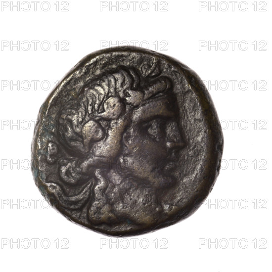Bronze coin, Pantikapaion; obv.: head of young Dionysus in an ivy wreath facing right; rv.: bow and arrows in a gorytos with straps, monogram on the left. Iconography: bow in a quiver, head of Dionysus, gorytos, quivers, bows, weapons, armament. Date: end of 2nd–ca. mid. 1st century BC (time of Mithridates VI Eupator, 120–63 BC). Region: Cimmerian Bosporus, Pantikapaion. Weight: 14.50 g. Dimensions: 24 mm × 23.8 mm. Makers/attribution: Terlecki, Ignacy (1860–1916).