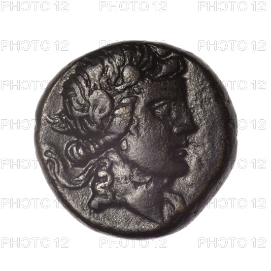 bronze coin, Pantikapaion; obv.: head of young Dionysus in an ivy wreath facing right; rv.: bow and arrows in a gorytos with straps, monogram on the left; iconography: bow in a quiver, head of Dionysus, gorytos, quivers, monograms, bows, weapons, armament; date: end of 2nd – ca. mid. 1st century BC (time of Mithridates VI Eupator, 120–63 BC); region: Cimmerian Bosporus; weight 16.79 g; diameter ~24.5–25.1 mm; maker: Pantikapaion; mythology: Dionysus.