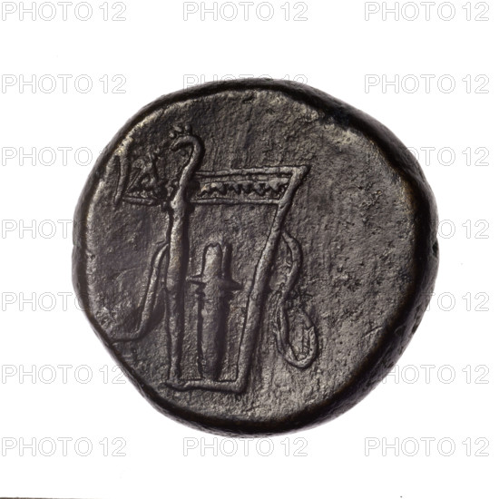 Bronze coin, Pantikapaion; obverse: head of young Dionysus in an ivy wreath facing right; reverse: bow and arrows in a gorytos with straps, monogram on the left. Iconography: bow in a quiver, head of Dionysus, gorytos, quivers, bows, weapons, armament. Date: end of 2nd–ca. mid. 1st century BC (time of Mithridates VI Eupator, 120–63 BC). Region: Cimmerian Bosporus, Pantikapaion. Weight: 16.79 g. Dimensions: 24.5–25.1 mm. Makers/attributions: Terlecki, Ignacy (1860–1916).