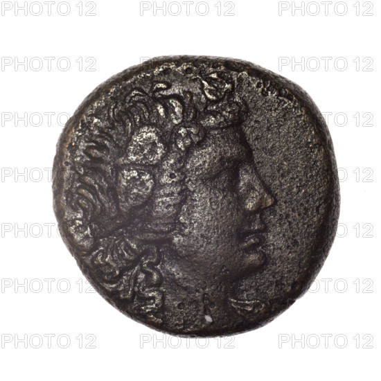 Bronze coin, Pantikapaion; obverse: head of young Dionysus in an ivy wreath facing right; reverse: bow and arrows in a gorytos with straps, monogram on the left. Iconography: bow in a quiver, head of Dionysus, gorytos, quivers, bows, weapons, armament. Date: end of 2nd–ca. mid-1st century BC (time of Mithridates VI Eupator, 120–63 BC). Region: Cimmerian Bosporus, Pantikapaion. Weight: 14.36 g. Axis: 330°. Dimensions: 23.5 mm × 23.8 mm. Makers/inscriptions: monograms.