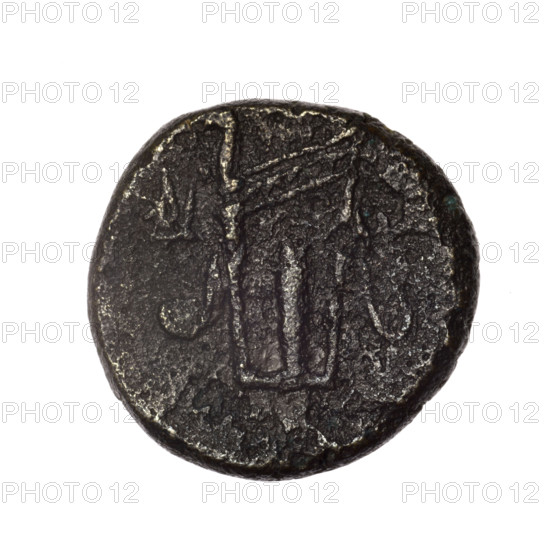 Bronze coin, Pantikapaion; obverse: head of young Dionysus in an ivy wreath facing right; reverse: bow and arrows in a gorytos with straps, monogram on the left. Iconography: bow in a quiver, head of Dionysus, gorytos, quivers, bows, weapons, armament. Dionysus (mythology). Cimmerian Bosporus, Pantikapaion. End of 2nd–ca. mid. 1st century BC (time of Mithridates VI Eupator, 120–63 BC). Coin; weight 14.36 g; axis 330°; dimensions 23.5 × 23.8 mm.