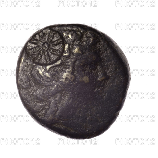 bronze coin, Pantikapaion; obv.: head of young Dionysus in ivy wreath facing right, countermark (star); rv.: bow and arrows in gorytos with straps, monogram, countermark (star) on the left; iconography: bow in quiver, head of Dionysus, gorytos, quivers, eight-pointed star; numismatic features: countermarks, monograms; subject: Dionysus, bows, weapons, armament; Black Sea, Cimmerian Bosporus, Pantikapaion; date: end of 2nd — ca. half of 1st century BC (time of Mithridates VI Eupator, 120–63 BC); coin; bronze; weight 16.97 g; dimensions 24.2–24.3 mm.