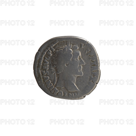 Denarius of Antoninus Pius (86–161; Roman emperor 138–161). Obverse: head of the emperor in a laurel wreath facing right, legend 'ANTONINVS AVG PI - VS PP TR P XVIII'. Reverse: Annona (personification) standing left, holding ears of corn in her right hand and resting her left on a container (modius) standing on a ship, legend 'C OS - IIII'. Iconography: Annona, ears of corn, modius, personifications, ships. Date: 154–155. Culture/place: Roman Empire, Rome. Medium: coin; diameter 18.0–19.0 mm; weight 2.76 g; axis 0°.