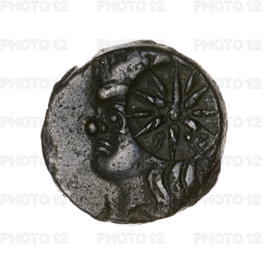 Bronze coin, Pantikapaion, beginning of the 3rd century BC, Cimmerian Bosporus. Obverse: head of a beardless Satyr in an ivy wreath facing left, with a twelve-pointed countermark (star) on it. Reverse: lion head with open mouth facing left, sturgeon below facing left, letters on the sides and at the top, countermark on the head (arch in the quiver). Iconography: Satyr's head, lion head, countermarks, bow in a quiver, stars, fish (sturgeon), twelve-pointed star, gorytos, quivers, weapons/armament. Weight 6.95 g; axis 300°; dimensions 19.6 × 20.2 mm.