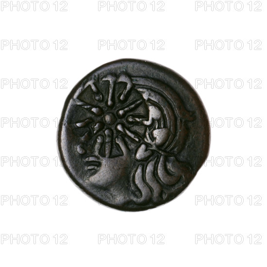 bronze coin, Pantikapaion; obverse: head of a beardless Satyr in an ivy wreath facing left with a countermark (twelve-pointed star) on the head; reverse: lion head with gaping mouth facing left, below it a sturgeon facing left, letters at sides and top, countermark on the head (bow in quiver). Iconography: lion head, Satyr's head, stars, bow in quiver, fish (sturgeon), twelve-pointed star, gorytos, quivers, weapons. Early 3rd century BC, Cimmerian Bosporus, Pantikapaion. Coin (bronze), weight 6.40 g, diameter ~20.5–20.6 mm.