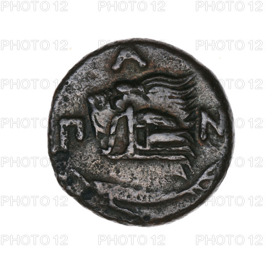 Bronze coin, Pantikapaion; obverse: head of a beardless Satyr in an ivy wreath facing left, with a twelve-pointed star countermark on the head; reverse: lion head with open mouth facing left, sturgeon below facing left, letters on the sides and at the top, countermark on the head (arch in the quiver). Iconography: Satyr's head, lion's head, bow in a quiver, stars, fish (sturgeon), gorytos, quivers, weapons. Satyr (mythology), lions, sturgeons. Beginning of the 3rd century BC; Cimmerian Bosporus, Pantikapaion. Coin. Weight 6.00 g; axis 330°; dimensions: 20 mm and 20.4 mm.