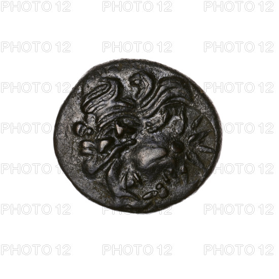 Bronze coin, Pantikapaion; obverse: head of a bearded Satyr in an ivy wreath to the left, pierced on the type of a beardless Satyr to the left, countermarked with a twelve-pointed star; reverse: bow and arrow to the right, inscription below, pierced on the type of a lion's head and a sturgeon to the left, countermarked with an arc in the quiver. Iconography: bow and arrow, Satyr's head, stars, bow in quiver, Satyr (mythology), arrows, bows, weapons, gorytos, animals, sturgeons, twelve-pointed star, fish, lion's head, lions. Countermarks. 1st half of the 3rd century BC. Cimmerian Bosporus, Pantikapaion. Coin; weight 6.80 g; axis 330°; dimensions ~20.5 × 20.3 mm.