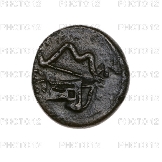bronze coin, Pantikapaion; head of Satyr (iconographic); bow and arrow (iconographic); bow in quiver (iconographic); countermarks (numism); stars; Black Sea; Satyr (mythology); arrows (weapon); bows (weapon); weapons (iconographic); armament (iconographic); gorytos (weapon); animals; sturgeons; twelve-pointed star (iconographic); fish; lion's head (iconographic); lions. Obverse: head of bearded Satyr in ivy wreath to the left, pierced on the type of beardless Satyr to the left, countermarked with twelve-pointed star. Reverse: bow and arrow to the right, inscription below, pierced on the type of a lion's head and a sturgeon to the left, countermarked with a bow in a quiver. 1st half of the 3rd century BC; Cimmerian Bosporus, Pantikapaion; coin; weight 6.38 g; diameter ~21.6 mm and 20.5 mm.