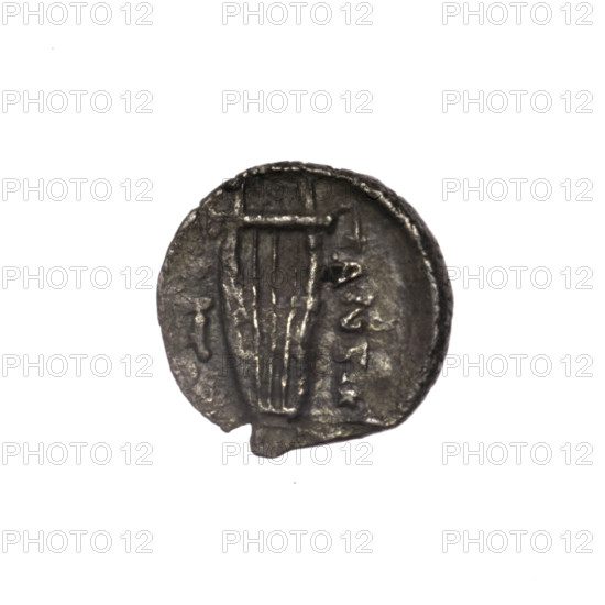 Diobol, Pantikapaion; obverse: head of Apollo right; reverse: lyre, inscription in two columns on the sides; subject: lyres (musical instruments), head of Apollo (iconographic), Apollo (mythology); date: 1st half of the 2nd–ca. mid-2nd century BC; region: Cimmerian Bosporus, Pantikapaion; object type: coin; weight 0.90 g; dimensions: 12.9 mm and 13.1 mm.