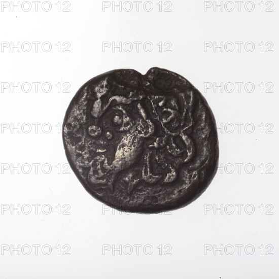 Bronze coin, Pantikapaion; obverse: head of bearded Satyr in ivy wreath facing left; reverse: cornucopia, Dioscuri caps topped with stars on the sides, inscription below them; iconography: Dioscuri caps, Satyr's head, cornucopia; subject: Satyr (mythology), Dioscuri (mythology); date: 4th quarter of the 2nd century BC; region: Cimmerian Bosporus, Pantikapaion; maker/material: bronze coin; weight: 3.68 g; axis: 330°; dimensions: 17 mm × 17.8 mm.