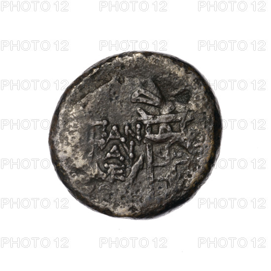 Bronze coin, Pantikapaion; obverse: head of Apollo in a laurel wreath to the right; behind it a tripod, behind the tripod a thyrsus with ribbons diagonally to the right; monograms on left and right; inscription in two rows on the sides. Iconography: head of Apollo, tripod, thyrsus, monograms. Date: 1st quarter of the 1st century BC (95–65 BC according to Frolov). Region: Cimmerian Bosporus, Pantikapaion. Coin; weight 7.29 g; diameter 20.2–21.2 mm. Maker: Pantikapaion.