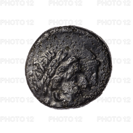 Bronze coin, Pantikapaion; obverse: head of Apollo in a laurel wreath facing right; reverse: tripod with an eight-pointed star at the top, behind it a thyrsus with ribbons diagonally facing right, a monogram in the right field, inscription in two rows at the bottom; iconography: Apollo, tripod, thyrsus, stars; monograms; ca. 1st century BC (mid-2nd century?); Cimmerian Bosporus, Pantikapaion; coin; weight 6.54 g; dimensions 20.8 mm × 20.4 mm.