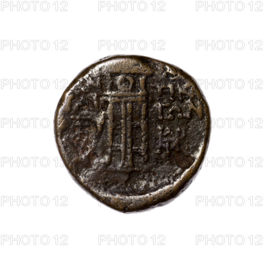 Bronze coin, Pantikapaion. Obverse: head of Apollo in a laurel wreath facing right. Reverse: tripod; behind it a thyrsus with ribbons diagonally to the right; monograms left and right; inscription in two rows on the sides. Iconography: head of Apollo, tripod, thyrsus. Date: 1st quarter of the 1st century BC (95–65 BC). Region: Cimmerian Bosporus, Pantikapaion. Medium: bronze. Weight: 5.00 g. Dimensions: 20 mm × 19.8 mm.