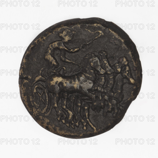 Bronze coin, Chersonesos; obverse: Artemis on a quadriga to the right, torch in raised right hand; reverse: naked warrior kneeling to the left, round shield in left hand, spear in right hand held horizontally, helmet on head, letter in right field, incised inscription XEP; iconography: kneeling warrior, Artemis on a quadriga, quadriga, carts, torch (attribute); mythology: Artemis (Deva); Black Sea; maker: Ignatius Terlecki (1860–1916); date: 350–330 BC; place: Chersonesos Taurica; object type: coin; material: bronze; weight: 6.63 g; dimensions: 20.2 mm × 20 mm.