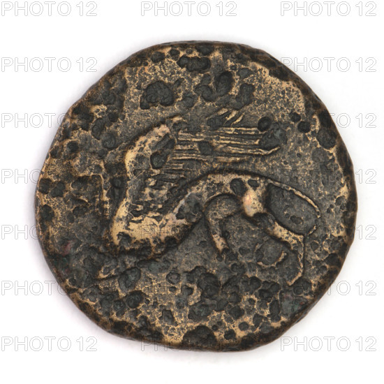 Bronze coin, Chersonesos, 330–320 BC. Obverse: eagle-headed griffin to left. Reverse: Artemis kneeling on her right knee to right, bow in her left hand; inscription API on left, XEP (cut-off). Artemis (mythology), Artemis with a bow, Black Sea region. Chersonesos Taurica. Coin; weight 10.30 g; axis 240°; dimensions 22.2 mm × 23 mm.
