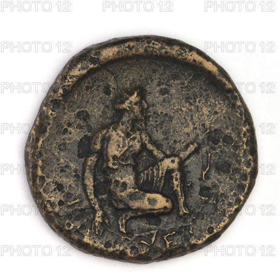 Bronze coin, Chersonesos, 330–320 BC. Obverse: eagle-headed griffin facing left. Reverse: Artemis kneeling on her right knee to the right, bow in her left hand; inscription API on the left, XEP (cut-off). Artemis (mythology); Black Sea region (Chersonesos Taurica). Coin; weight 10.30 g; diameter approx. 22.2–23 mm; axis 240°.