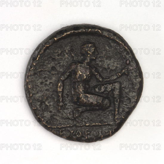 bronze coin, Chersonesos, griffins, Artemis kneeling, Black Sea, Artemis (mythology), Artemis with bow and arrow, eagle-headed griffin to the left, on the left XEP (beheaded); reverse: Artemis (Deva) kneeling on right knee to the right, bow in left hand, official's name in the cut-off; 310–300 BC, Chersonesos Taurica, coin, weight 5.85 g, axis 180°, diameter 19.2 mm