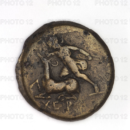Bronze coin, Chersonesos (Chersonesos Taurica), 300–290 BC. Obverse: Artemis (Deva) to the left thrusting a spear into a kneeling doe, bow in her left hand; inscription 'XEP rw' at the bottom. Reverse: bull charging left with a club; inscription below, bow and quiver below. Iconography: Artemis killing a doe; Artemis with bow, quiver; weapons/armament; bulls; clubs; animals. Weight 7.13 g; axis 180°; diameters 21.8 mm and 21.1 mm.