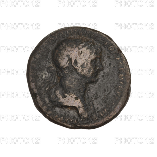 Trajan (53–117; Roman Emperor 98–117). Obverse: head of Trajan in a radiant crown; rim inscription illegible. Reverse: Victoria with wings, dressed in a long robe, striding right, holding a laurel wreath in her outstretched right hand and a trophy on her left shoulder; letters SC on either side of her; rim inscription poorly legible. Coin dated 115–116, Roman Empire (27 BC–476), Rome. Weight 10.74 g.