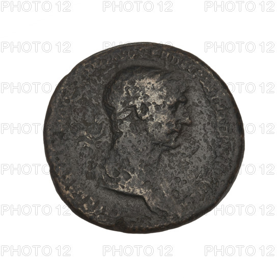 Trajan (53–117; Roman Emperor 98–117). Bronze coin, 116–117 CE, Rome. Obverse: bust of Trajan facing right in a radiant crown; rim inscription illegible. Reverse: Trajan in military attire striding right between two trophies, head turned left, right hand stretched toward a trophy, scepter in left; only two trophies visible on this coin; rim inscription illegible; letters SC present. Weight 22.0 g.
