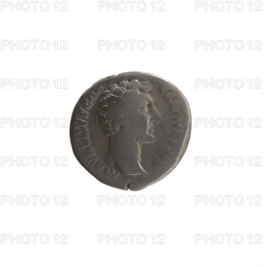 denarius, Marcus Aurelius (121–180; Roman emperor 161–180), (caesar 139–161), Antoninus Pius (86–161; Roman emperor 138–161), (issuer), Marcus Aurelius (heir to the throne; 138–161) - iconography; Antoninus Pius (86–161; Roman emperor 138–161) - iconography; personifications, Clementia (personification), paterae. Obverse: Head of young Marcus Aurelius without a cap facing right, legend M AVRELIVS CAE - SAR AVG PII F. Reverse: Clementia stands frontally, head turned left, holds a patera in right hand and lifts the hem of her robe with left, legend OT III - COS II, CLEM in section. Date: 148–149 CE. Roman Empire (27 BCE–476 CE). Coin; diameter 17.5–18.0 mm; weight 2.82 g; axis 210°.