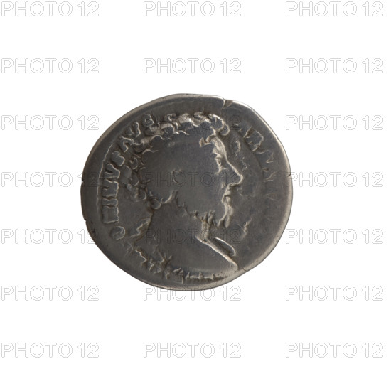 Denarius, Marcus Aurelius (121–180; Roman emperor 161–180), issuer; obverse: bust of Marcus Aurelius without a covering, in armor and drapery on the left shoulder, facing right, legend ANTONINVS AVG - ARMEN PM; reverse: personification of Armenia in a short robe, trousers and a pointed cap, seated left, supporting her head with her right hand, left hand resting on a bow and a quiver, with a shield and a standard (vexillum) in front, legend PM TR P XVIII, MP II COS III, inscription ARMEN.; dated 163–164 CE; Roman Empire, Rome; coin; silver denarius; diameter 18.0 mm; weight 3.03 g; axis 180°.