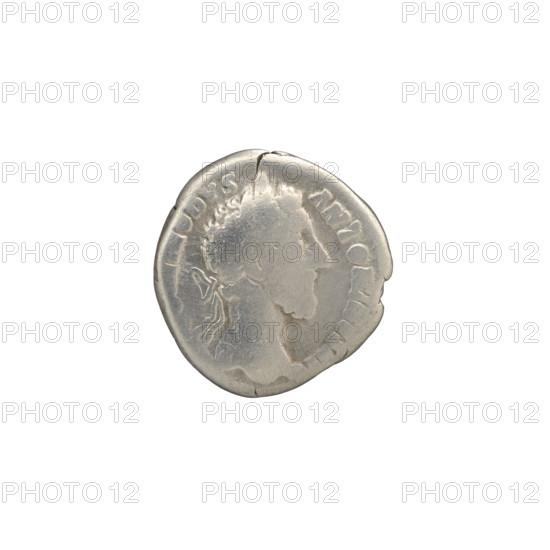 Denarius of Commodus (reigned 177–192). Obverse: Head of Commodus in laurel wreath to the right, inscription MMODVS - ANTONINVS AVG. Reverse: Roma seated on a shield to the left, holding Victoria in her right hand and a spear in her left, inscription TRP VI IMP IIII COS III PP. Iconography: Roma, Commodus, shields, Victoria, spears. Date: 181 CE, Rome, Roman Empire. Medium: coin; diameter 17.0–18.5 mm, weight 2.65 g, axis 0°.