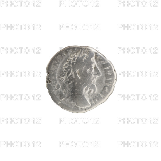 Denarius, Commodus (161–192), issuer. Obverse: Head of Commodus in a laurel wreath to the right, inscription M COMM ANT - FEL AVG BRIT. Reverse: Naked Genius standing left, holding a patera in his right hand and ears of corn in his left, inscription PM TR - VIII COS V PP. Date: 187–188. Place: Rome, Roman Empire. Coin; diameter 17.0–18.0 mm; weight 2.71 g; axis 0°. Iconography: Genius, ears of corn, paterae, personifications.