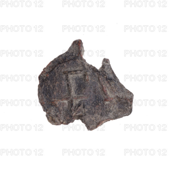 Fragment of a double-sided Drohiczyn seal. One side: an eagle with its head turned to the left. Other side: a bident with a crossed-out right arm. 11th–13th century. Drohiczyn, Poland.