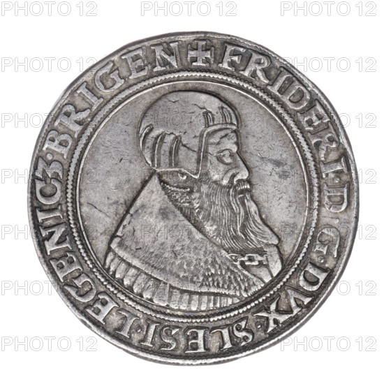 Thaler by Michael Stoltz (fl. ca. 1540–1555) depicting Frederick II, Duke of Brzeg-Legnica (1480–1547). Obverse: male bust turned right with beard and sideburns, wearing a bonnet and a coat with a wide collar fastened on the chest with a chain; rim inscription '+FRIDERI.DGDVX.SLESI.LEGENIC3.BRIGEN'. Reverse: four-field coat of arms of the Duchy of Legnica–Brzeg topped with a jewel with labres; rim inscription 'VERBVM.DOMINI.MANET.IN.ETERNVM. I54I.' Date: 1541. Silesia, Duchy of Brzeg-Legnica-Wolów, Legnica. Coin. Diameter 39.6 mm; weight 27.93 g; axis 135°.