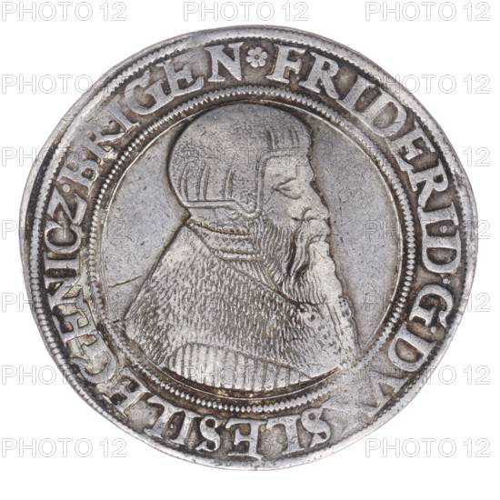 Thaler, Frederick II (Duke of Brzeg-Legnica; 1480–1547); maker: Michael Stoltz (fl. ca. 1540–1555). Obverse: Male bust of Frederick II turned right with beard and sideburns, wearing a bonnet and a coat with a wide collar and chain; rim inscription beginning with a rosette FRIDERI·DGDVX·SLESI·LEGENICZ·BRIGEN. Reverse: Four-field coat of arms of the Duchy of Legnica-Brzeg topped with a jewel with labres; rim inscription VERBVM·DOMINI·MANET·IN·ETERNVM·I546. 1546. Silesia, Duchy of Brzeg-Legnica-Wolów, Legnica. Coin; diameter 42.0 mm; weight 29.12 g; axis 180°. Subjects: Piasts (family), iconography, busts, portraits of rulers, heraldic shield under a helmet with labres.