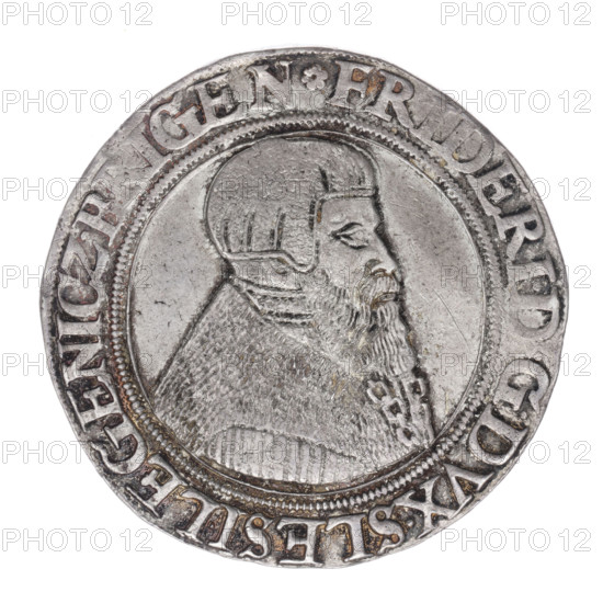 Thaler by Michael Stoltz (fl. ca. 1540–1555), 1546. Obverse: male bust of Frederick II, Duke of Brzeg-Legnica (1480–1547), turned right, with beard and sideburns, wearing a bonnet and coat with a wide collar and chain; rim inscription beginning with a rosette FRIDERI·D G D VX·SLESI·LEGENICZ·BRIGEN. Reverse: four-field coat of arms of the Duchy of Legnica–Brzeg topped with a jewel and labres; rim inscription VERBVM·DOMINI·MANET·IN·ETERNVM·I546. Silesia, Duchy of Brzeg–Legnica–Wolów, Legnica. Silver coin; diameter 39.6 mm, weight 29.15 g, axis 45°. Subjects: Piasts (family), portraits of rulers, busts, coats of arms.