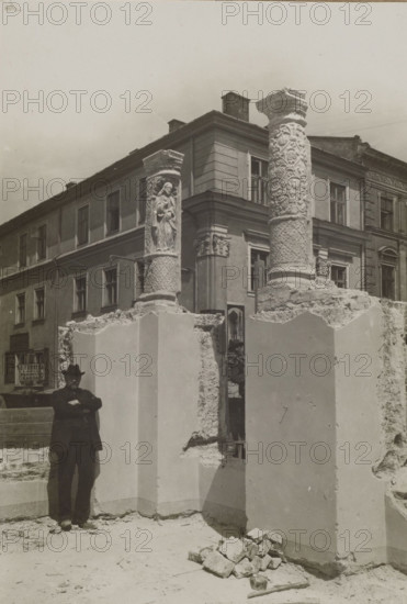 Lviv (Ukraine). Columns from the Zipperowska tenement house at ul. Trybunalska. Photographer: Józef Kosciesza-Jaworski (fl. ca. 1911–ca. 1929). Subject: decorative elements—columns and bas-reliefs; Polish architecture and sculpture. Photographic print glued over entire surface on brown cardboard. Negative: 1911. Print date: 1911–ca. 1922. Photography from nature. Photographic print: height 17 cm, width 11.6 cm; mount: height 35.2 cm, width 25.6 cm.