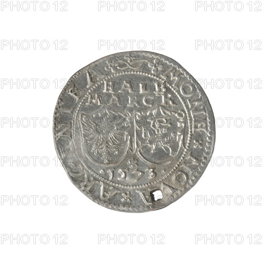 Livonian half-mark (half-fine), Sigismund II Augustus (king of Poland; 1544–1572), (interregnum), Chodkiewicz, Jan Hieronimowicz (ca. 1537–1579), (administrator of Livonia), Iberfeld, Walentyn (fl. 1572–1573), publisher, Hincza, Jakub (fl. 1572–1573), publisher. Gryf with Sword (coat of arms; Inflanty), coats of arms, gryphons, Jagiellons (dynasty), Polish coin, inscriptions, coats of arms, heraldic shields, Pogon (coat of arms), Eagle (coat of arms). Obverse: Below the inscription: HALB/MARCK; two heraldic shields with the Eagle and Pogon; below the year: .1573.; in the rim the inscription: .MONE.NOV, .ARGENTEA. Reverse: Gryf with a raised sword turned to the left separating the inscription in the rim: .-DVCATVS.LIVO. IAE, 1573. Inflanty, Dahlholm, Poland. Coin; diameter 28.2 mm (other measure 28.9 mm); weight 5.5 g.
