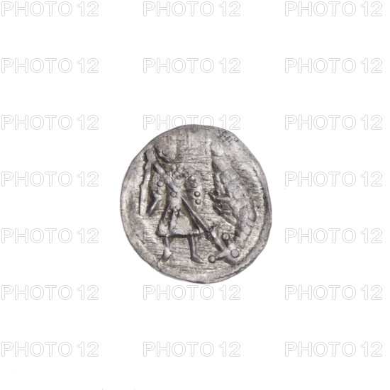 Denarius of Boleslaw III Krzywousty (prince of Poland; 1086–1138), ca. 1125–1138. Obverse: in the beaded border, a knight in chain mail thrusting the tip of a spear into the mouth of an upside-down dragon. Reverse: in the triple beaded border, an isosceles cross topped with balls (three of them with one dot each; the fourth is effaced). Between its arms, one ball (three with one dot each; the fourth effaced). One arm intersects the other at approximately 1/3 of its length. Romanesque style; iconography includes equal-armed cross, chain mail, spearhead/ spears, mouths, martyrs, knight, dragon, fight between good and evil, St. Wojciech, fight against pagans. Coin; Poland, Kraków. Diameter 13.0–13.5 mm; weight 0.48 g.