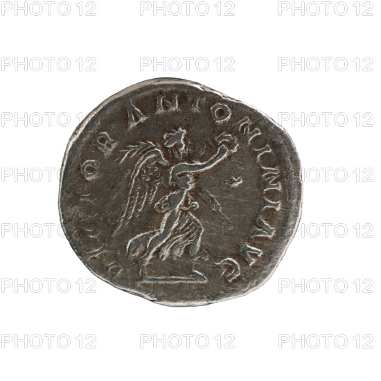 Antoninian of Elagabalus (reigned 218–222). Obverse: Bust of Elagabalus facing right, wearing a radiant crown, armor and paludamentum; pearl border; legend IMPCAESMAVRANTONINVSAVG. Reverse: Victoria running right, holding a wreath in her right hand and a palm branch in her left; pearl border; legend VICTOR ANTONINIAVG. Dated 218–219. Roman coin; diameter c. 20.0–21.5 mm; weight 4.63 g; axis 0°.