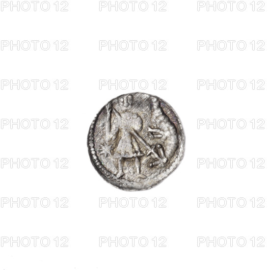 Denarius of Boleslaw III Krzywousty (prince of Poland; c. 1125–1138). Obverse: in a beaded border, a knight in chain mail thrusting a spearhead into the jaws of an upside-down dragon; a sun beneath the knight's right elbow. Reverse: in a triple beaded border, an isosceles cross topped with spheres (one dot on each); a sphere at the intersection of the arms; additional spheres between the arms (some dots indistinct due to wear). Iconography: spearhead (issue mark), equal-armed cross, chain mail, crosses, mouths, dragons, knights, fight between good and evil, Adalbert (St.; ca. 956–997), fight against pagans; Romanesque style. Minted in Kraków, Poland. Coin; diameter 11.8–12.2 mm; weight 0.42 g.