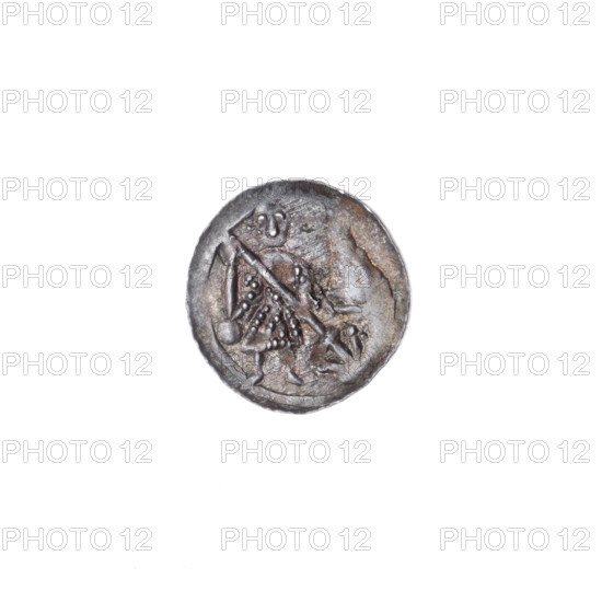 denarius, Boleslaw III Krzywousty (prince of Poland; 1107–1138), chain mail (iconographic), spearhead (issue mark), equal-armed cross (iconographic), allegories, crosses, mouth (iconographic), chain mail, knight (iconographic), martyrs, dragons, knights, mouths, dragon (iconographic), Middle Ages, Romanesque (style), fight between good and evil (iconographic), fight against pagans (iconographic), spear (iconographic), spears, Adalbert (St.; ca. 956–997). Obverse: in the beaded border, a knight in chain mail thrusting a spearhead into the jaws of an upside-down dragon; a ball under the knight's right elbow. Reverse: in the triple beaded border, an isosceles cross topped with balls, a ball at the intersection of the arms, and a single sun between them. ca. 1125–1138. Poland, Kraków. Coin; diameter 12.5 mm; weight 0.35 g.