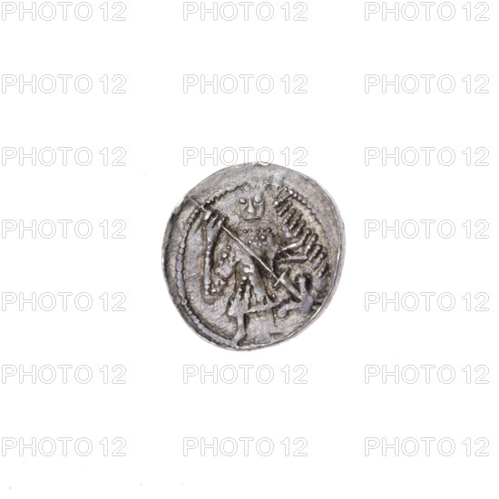 Denarius, Boleslaw III Krzywousty (prince of Poland; ca. 1086–1138). Romanesque silver coin, ca. 1125–1138, Poland, Kraków. Diameter 11.9–12.6 mm, weight 0.62 g. Obverse (in beaded border): a knight in chain mail thrusting a spearhead into the jaws of an upside-down dragon (iconography: knight, chain mail, spear/spearhead, jaws, dragon; themes: fight between good and evil, fight against pagans; possible reference to St. Adalbert). Reverse (in triple beaded border): an isosceles cross topped with balls; between its arms one small ball near the center and one sun near the ends (iconography: equal-armed cross, crosses, sun). State of preservation: very good.