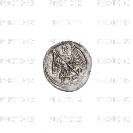 Denarius of Boleslaw III Krzywousty (prince of Poland; ca. 1125–1138). Av.: In the beaded border, a knight in chain mail thrusting a spearhead into the jaws of an upside-down dragon — motifs: knight, chain mail, spearhead, spear, dragon, jaws; Romanesque style; allegory of fight between good and evil and fight against pagans; martyrs; Adalbert (St.; ca. 956–997). Rv.: In the triple beaded border, an isosceles cross topped with spheres (one dot on each) with a single sun between its arms. Silver coin (denarius); diameter 12.2–12.7 mm; weight 0.57 g; Kraków, Poland; ca. 1125–1138.