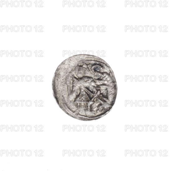 Denarius of Boleslaw III Krzywousty (prince of Poland; 1086–1138). Obverse: in the linear border, a knight in chain mail thrusting a spearhead into the jaws of an upside-down dragon. Reverse: in the triple beaded border, an isosceles cross topped with balls (two with one dot each); between its arms, one ball each with one dot. Allegorical imagery referencing St. Adalbert and the fight against pagans; motifs include equal-armed cross, crosses, spearhead (issue mark), spears, jaws, chain mail, knight, dragons, fight between good and evil; Romanesque style, Middle Ages. c. 1125–1138. Poland (Kraków). Coin (denarius). Diameter 12.2–12.9 mm; weight 0.53 g.