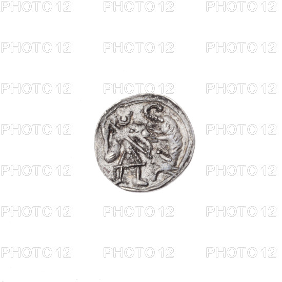 Denarius, Boleslaw III Krzywousty (prince of Poland; 1086–1138). Av.: In the linear border, a knight in chain mail thrusting a spearhead into the jaws of an upside-down dragon. Rv.: In the triple beaded border, an isosceles cross topped with spheres (one with a dot); at the intersection of the arms, a sphere; between the arms, a single sun. Allegorical Romanesque imagery referencing Adalbert (St.; ca. 956–997), martyrs, knights, dragons, the fight against pagans and the struggle between good and evil. ca. 1125–1138. Poland, Kraków. Coin (denarius). Diameter 11.6–11.9 mm; weight 0.53 g.