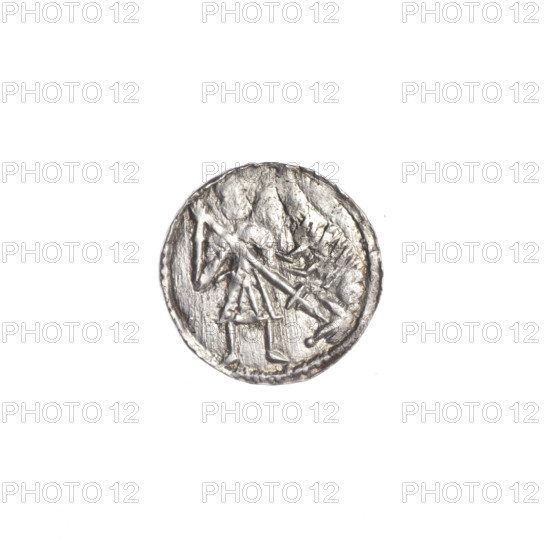 Denarius, Boleslaw III Krzywousty (prince of Poland; 1086–1138). Obverse: in a beaded border, a knight in chain mail thrusting a spearhead into the jaws of an upside-down dragon. Reverse: in a triple beaded border, an isosceles cross topped with balls; between its arms radiate two balls (smaller ones closer to the center, larger ones farther). Iconography: spearhead, chain mail, equal-armed cross, crosses, mouth, knight, martyrs, dragon, fight between good and evil, fight against pagans, Adalbert (Saint; ca. 956–997). Romanesque style. Date: ca. 1125–1138. Poland, Kraków. Coin (denarius). Diameter: 12.3–12.9 mm. Weight: 0.54 g. State of preservation: very good.