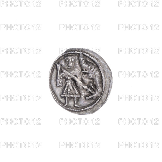 Denarius, Boleslaw III Krzywousty (Prince of Poland; 1107–1138). Romanesque silver coin, ca. 1125–1138, Poland, Kraków. Obverse: in a beaded border, a knight in chain mail thrusting a spearhead into the jaws of an upside-down dragon (allegory of fight between good and evil, fight against pagans; motifs: knight, dragon, spears, crosses, mouths, martyrs, Adalbert). Reverse: in a triple beaded border, an isosceles cross topped with crossbars; between its arms one ball; near one crossbar on its outer side a dot. Diameter 13.1–13.6 mm; weight 0.49 g. Very good state of preservation.