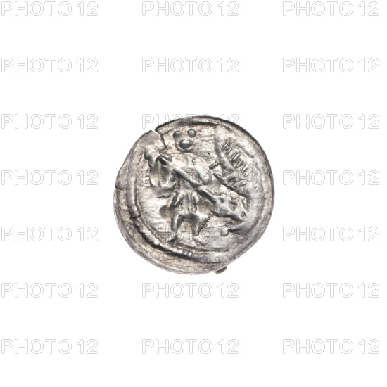 Denarius of Boleslaw III Krzywousty (prince of Poland; 1086–1138). Obverse (beaded border): a knight in chain mail thrusting a spearhead into the jaws of an upside-down dragon. Reverse (triple beaded border): an isosceles cross topped with balls; between its arms, one ball (one of them with a dot). Allegorical iconography referencing martyrs, knights, dragons, fight between good and evil, and the fight against pagans; possible association with Saint Adalbert. Romanesque style. Issue mark: spearhead. Date ca. 1125–1138. Poland, Kraków. Coin (denarius). Diameter: 12.6–13.4 mm. Weight: 0.35 g.
