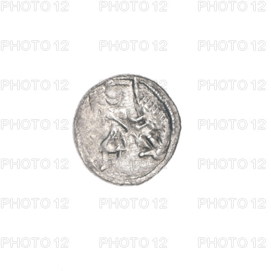 Denarius of Boleslaw III Krzywousty (prince of Poland; r. 1107–1138). Obverse: in a beaded border, a knight in chain mail thrusting a spearhead into the jaws of an upside-down dragon. Reverse: in a triple beaded border, an isosceles cross topped with balls; one ball between its arms. Iconography: allegories, equal-armed cross, spearhead (issue mark), crosses, chain mail, martyrs, Romanesque style, knight, dragons, Middle Ages, fight between good and evil, fight against pagans, spear, Saint Adalbert (ca. 956–997). Date: ca. 1125–1138. Place: Kraków, Poland. Medium: coin. Diameter: 12.9 mm. Weight: 0.43 g.