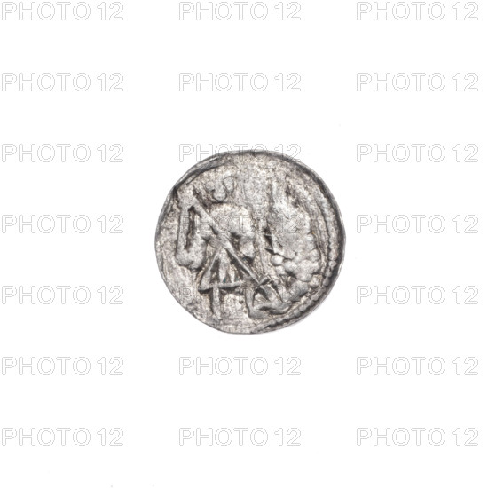 Denarius, Boleslaw III Krzywousty (prince of Poland; 1107–1138). Obverse: in the beaded border, a knight in chain mail thrusting a spearhead into the jaws of an upside-down dragon; depiction evokes fight between good and evil, fight against pagans, martyrs, Adalbert (Saint; ca. 956–997), allegories, dragons, knights. Reverse: in the triple beaded border, an isosceles cross topped with balls; at the intersection of the arms, a ball; between the arms, one ball. Issue mark: spearhead. Style: Romanesque. Date: ca. 1125–1138. Place: Poland, Kraków. Coin; diameter 11.9–12.1 mm; weight 0.42 g.