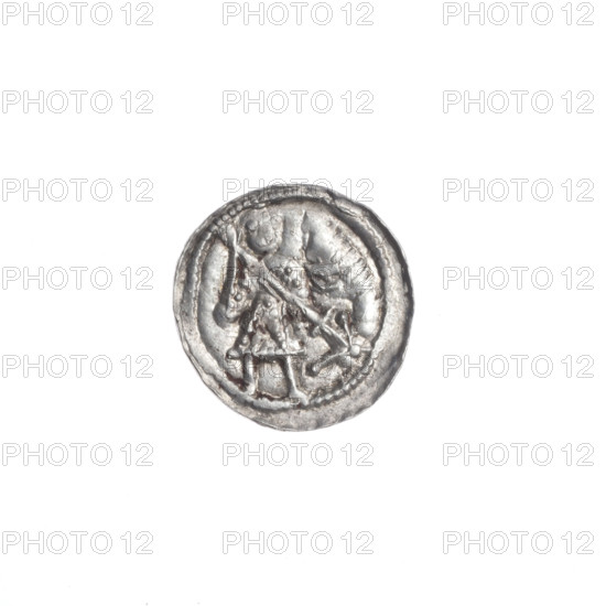 denarius, Boleslaw III Krzywousty (prince of Poland; 1107–1138), obverse: in beaded border, a knight in chain mail thrusting a spearhead into the jaws of an upside-down dragon; reverse: in triple beaded border, an isosceles cross topped with spheres (one with a dot), with a sun (each with a dot) between its arms; spearhead (issue mark), equal-armed cross; Romanesque style; motifs: knight, chain mail, dragons, fight against pagans, Adalbert (Saint; ca. 956–997), fight between good and evil; ca. 1125–1138, Kraków, Poland; coin; diameter 12.1–12.7 mm; weight 0.55 g; very good state of preservation
